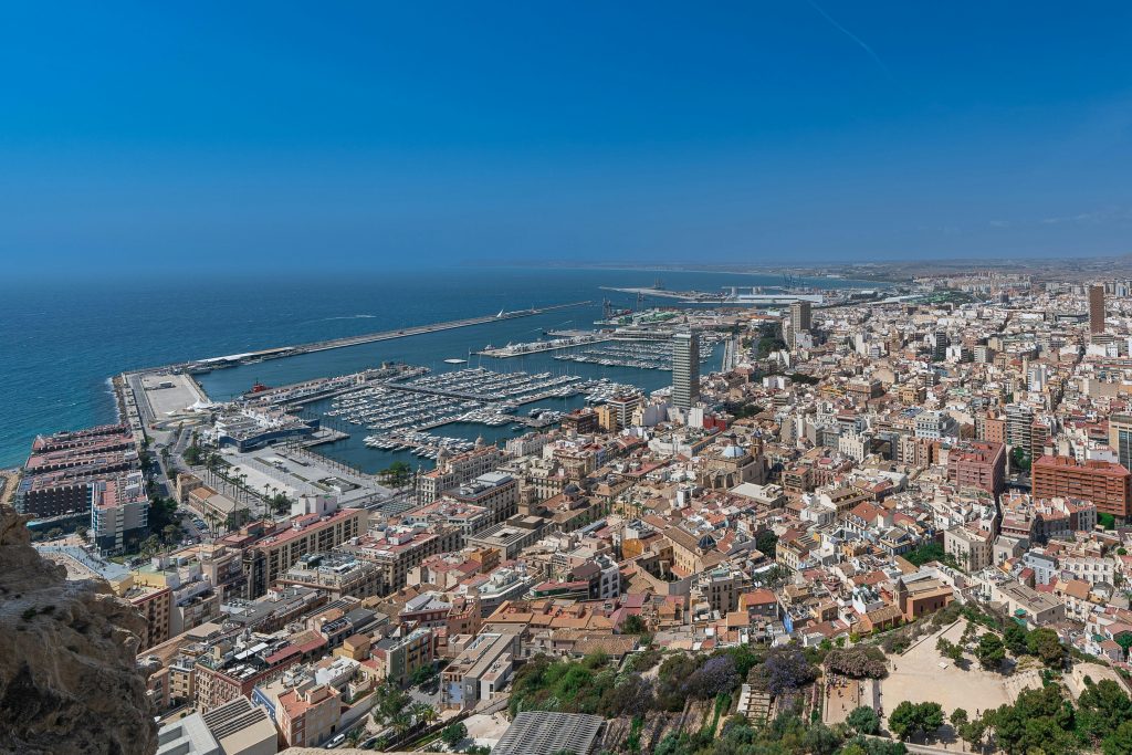 Stunning aerial view of Alicante's marina and cityscape under a clear blue sky.